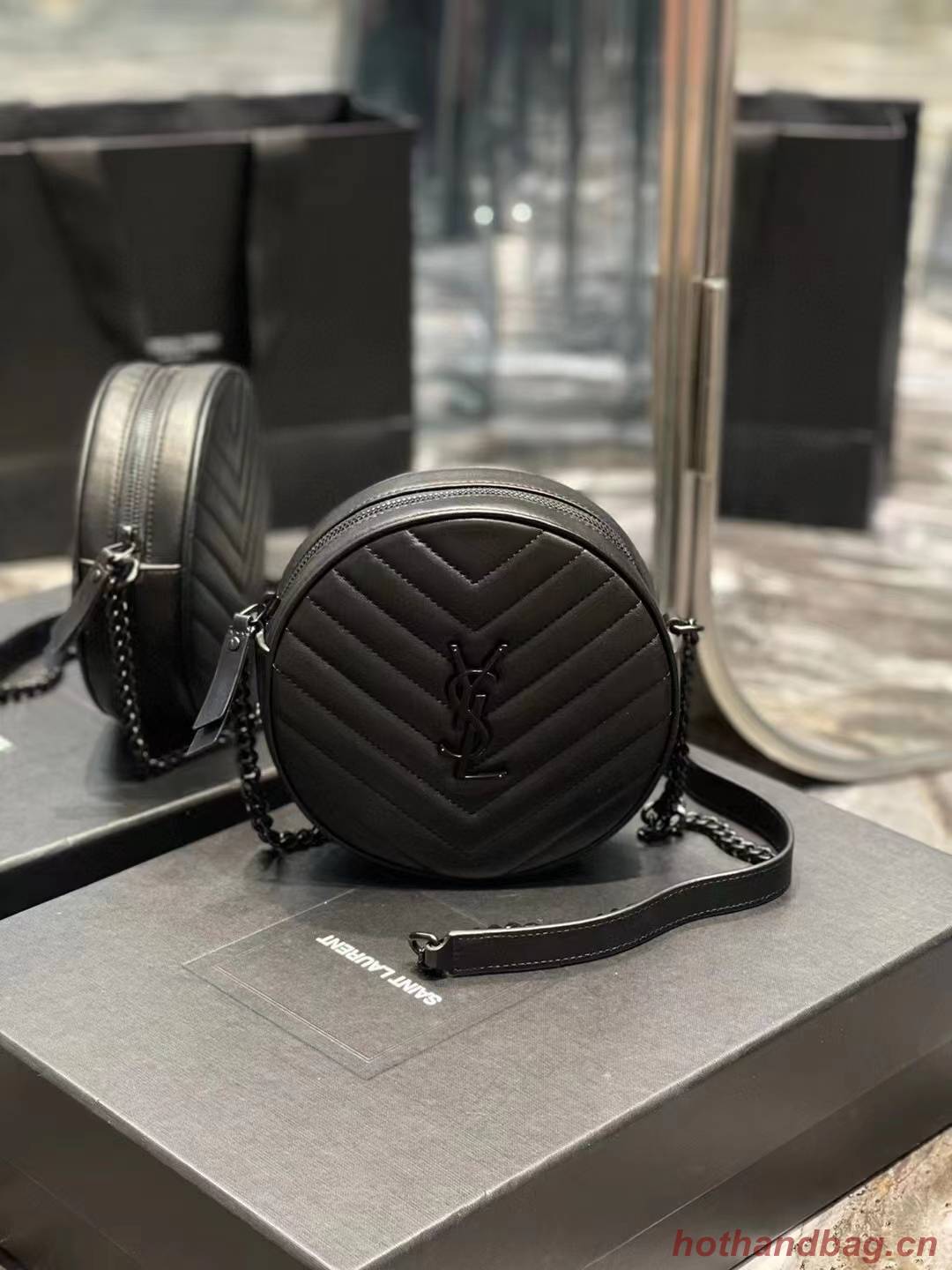 SAINT LAURENT VINYLE ROUND CAMERA BAG IN CHEVRON-QUILTED GRAIN DE POUDRE EMBOSSED LEATHER 6104361 black SAINT LAURENT VINYLE ROUND CAMERA BAG IN CHEVRON-QUILTED GRAIN DE POUDRE EMBOSSED LEATHER 6104361 black