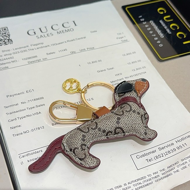 Gucci Dog-shaped bag charm 821812